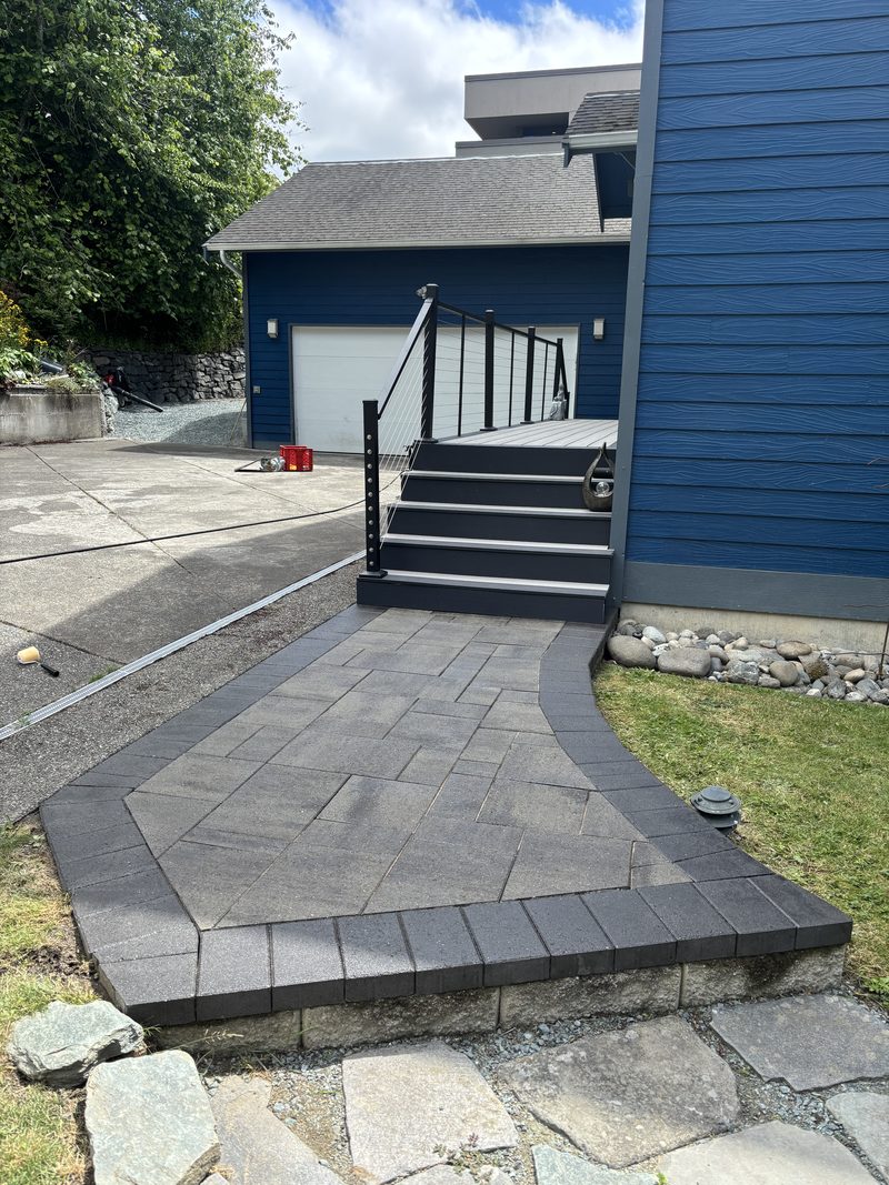 Charcoal paver walkway with contrast border built by ZNS